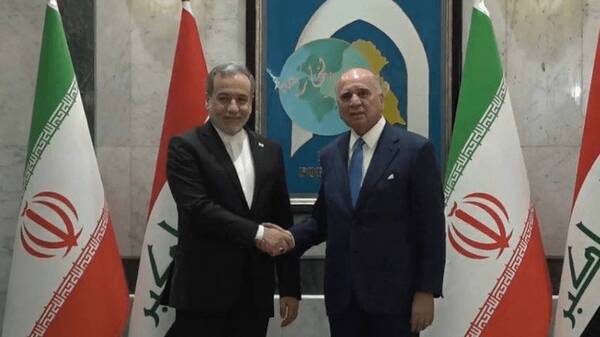 گفت‌وگوی دیپلماتیک تهران-بغداد: عراقچی و فؤاد حسین در میز مذاکره